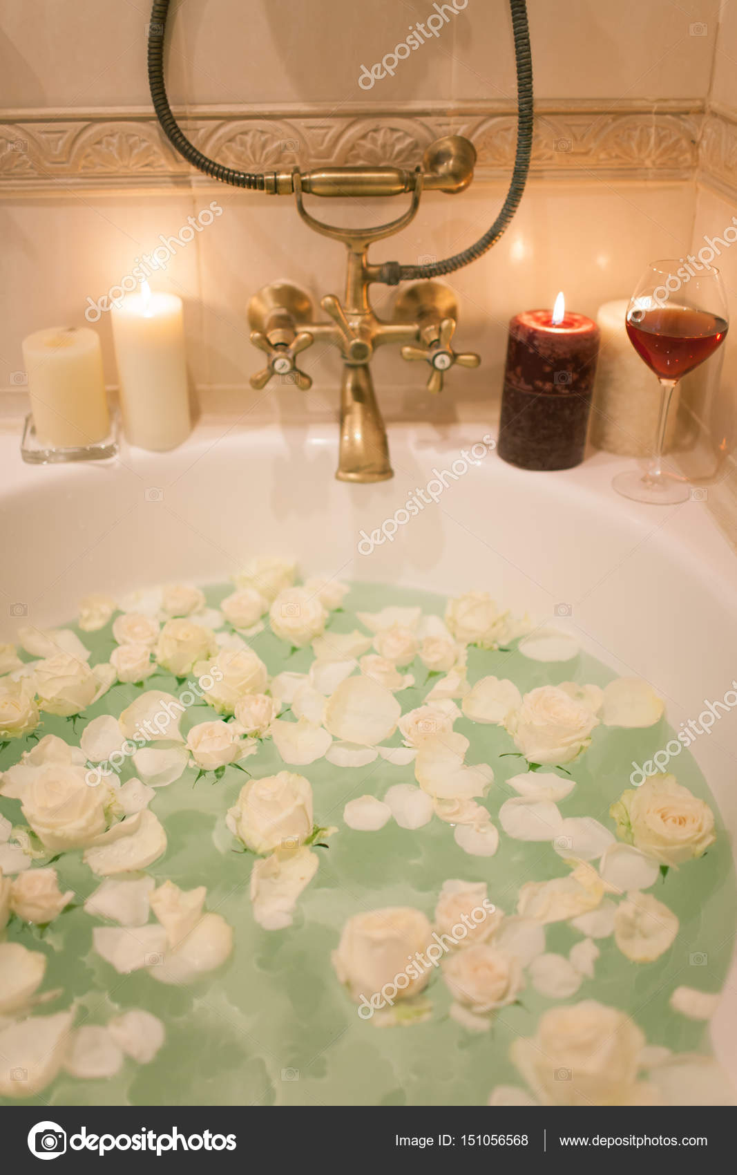 Take a bath with rose petals and candles. Romantic evening in th Stock  Photo by ©april_89 151056568